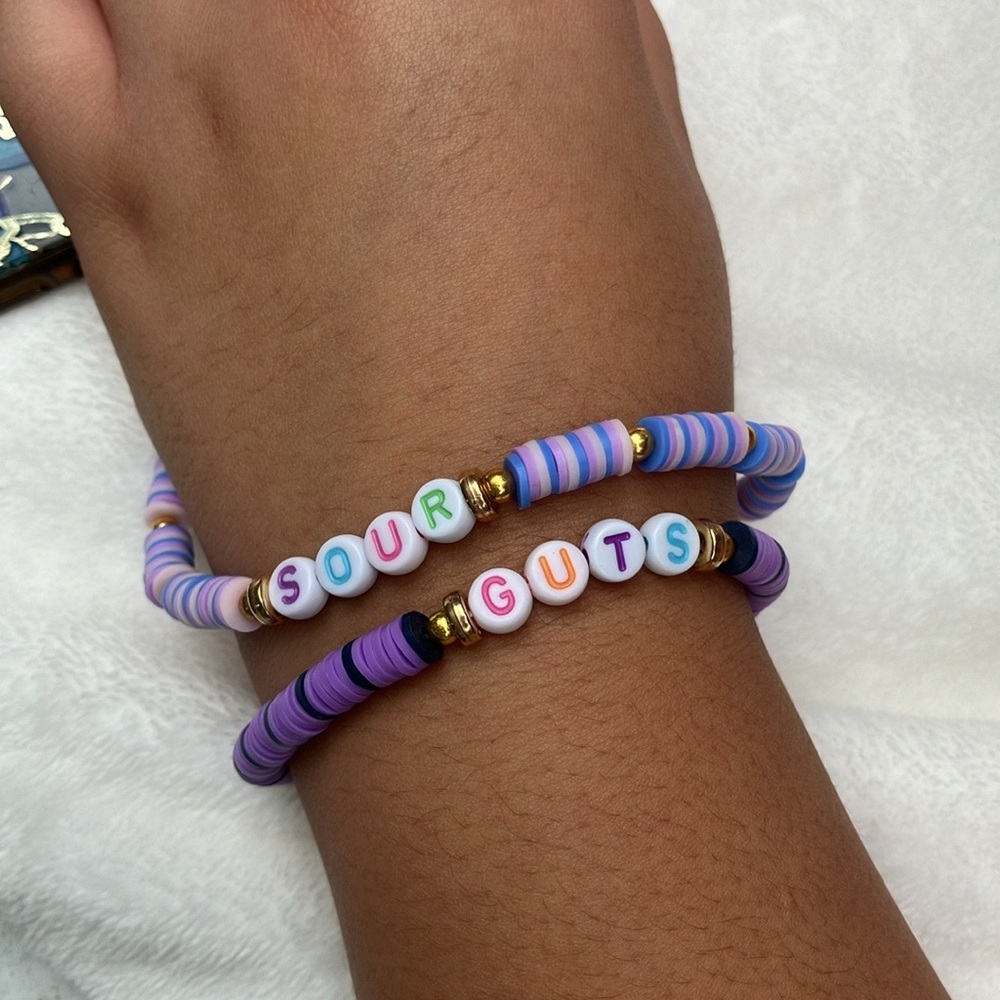 COPY - Olivia Rodrigo phone charmand bracelet title of her album sour and guts💜